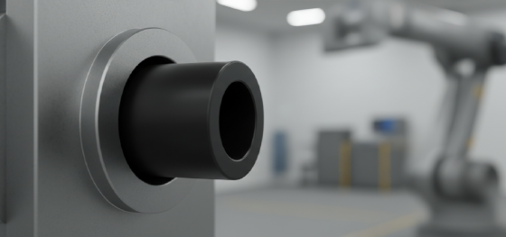 Black machined acetal bushing being press-fit into a heavy steel robotic joint