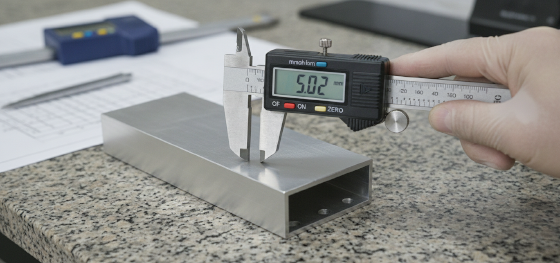 measuring early stage dimensional tolerances of raw metal hardware measuring early stage dimensional tolerances of raw metal hardware